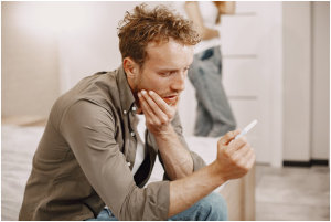 a man holding a stick test.