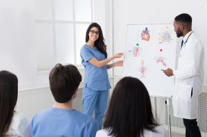 Doctors Sharing Experience With Colleagues At Medical Consultation