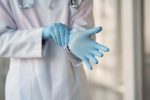 Nurse wearing latex gloves