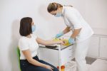 Nurse about to draw blood from a patient